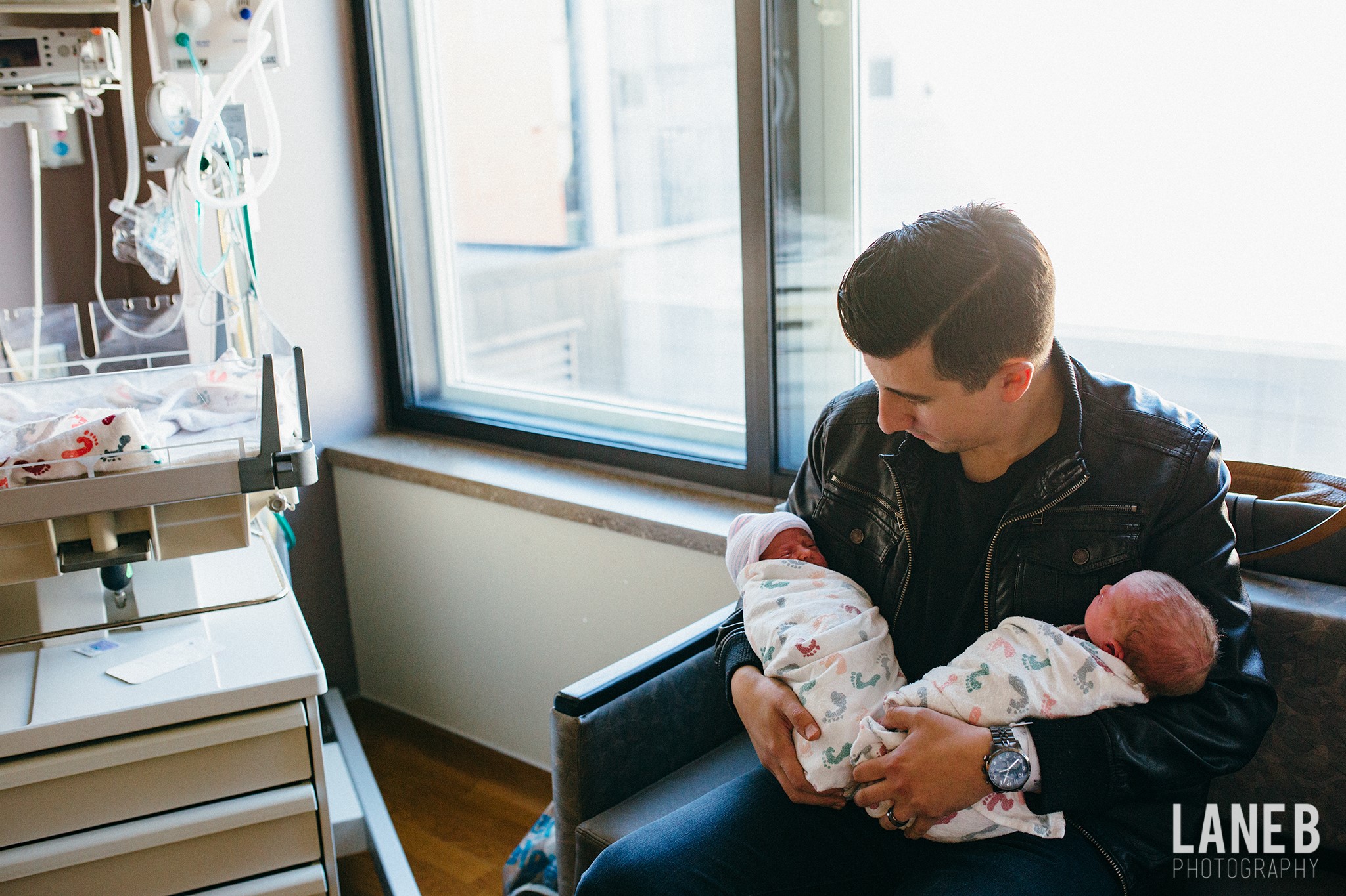 dad-holding-twins