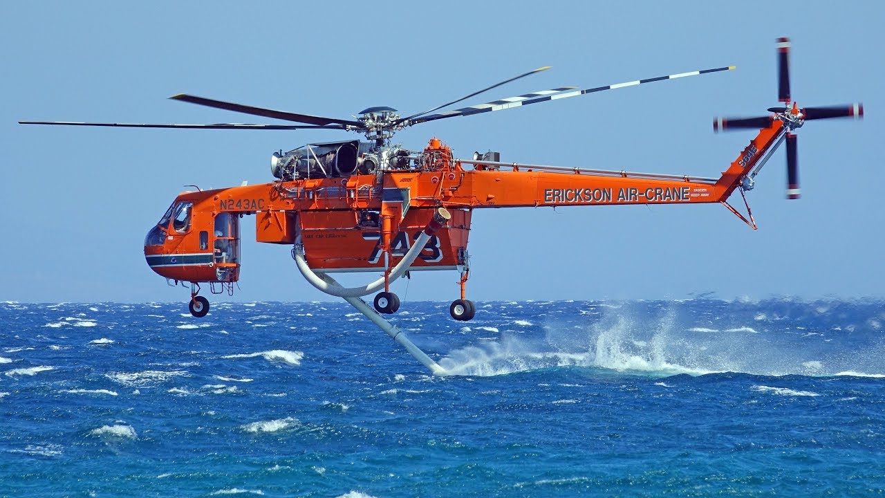 Erickson Air-Crane S-64E collecting water from the sea - YouTube