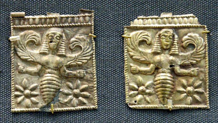 Gold plaques embossed with winged bee goddesses, perhaps the Thriae or an older goddess, found at Camiros, Rhodes, dated to the 7th century BCE (British Museum). Credits: Unknown artist - Jastrow (2006) – Public Domain