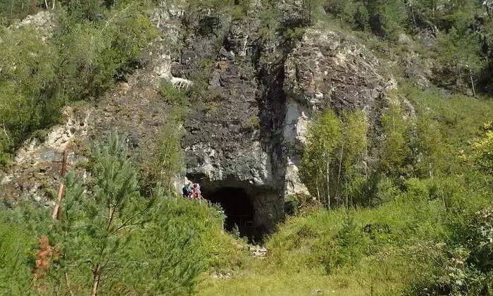 The entrance to Denisova Cave, the famous site in southern Siberia where remains of both Neandertals and their Asian… [more] © Richard G. Roberts