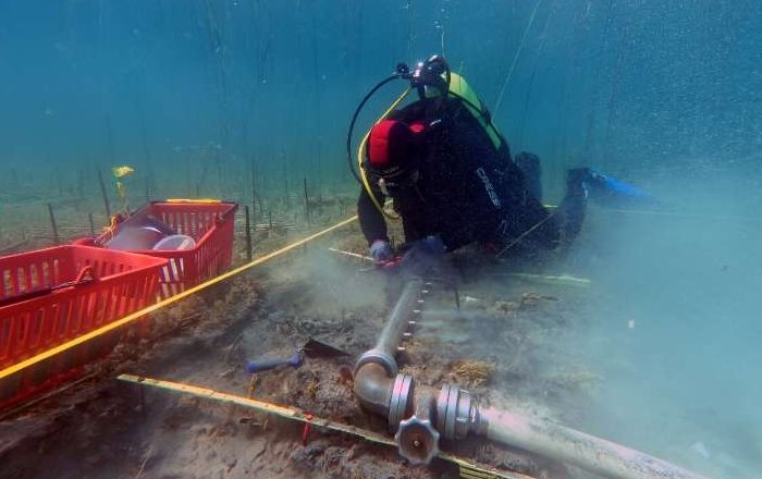 A diver scouring an archaeological site at the bottom of Lake Ohrid in Albania, the site of Europe's oldest stilt village.