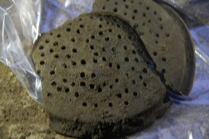 A perforated lid of a terracotta pipeline that could have been used as a filtering device was found during the 5th phase of excavation at Keeladi. PH๏τo Credit: ma23Keeladi