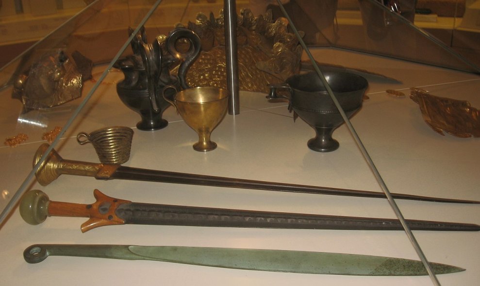 Museum replicas of Mycenaean swords and cups.