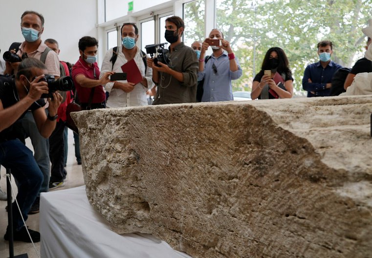 Photographers take pictures during the presentation to the press of an archeological finding that emerged during the excavations at a Mausoleum in Rome, Friday, July 16, 2021. (AP Photo/Domenico Stinellis)